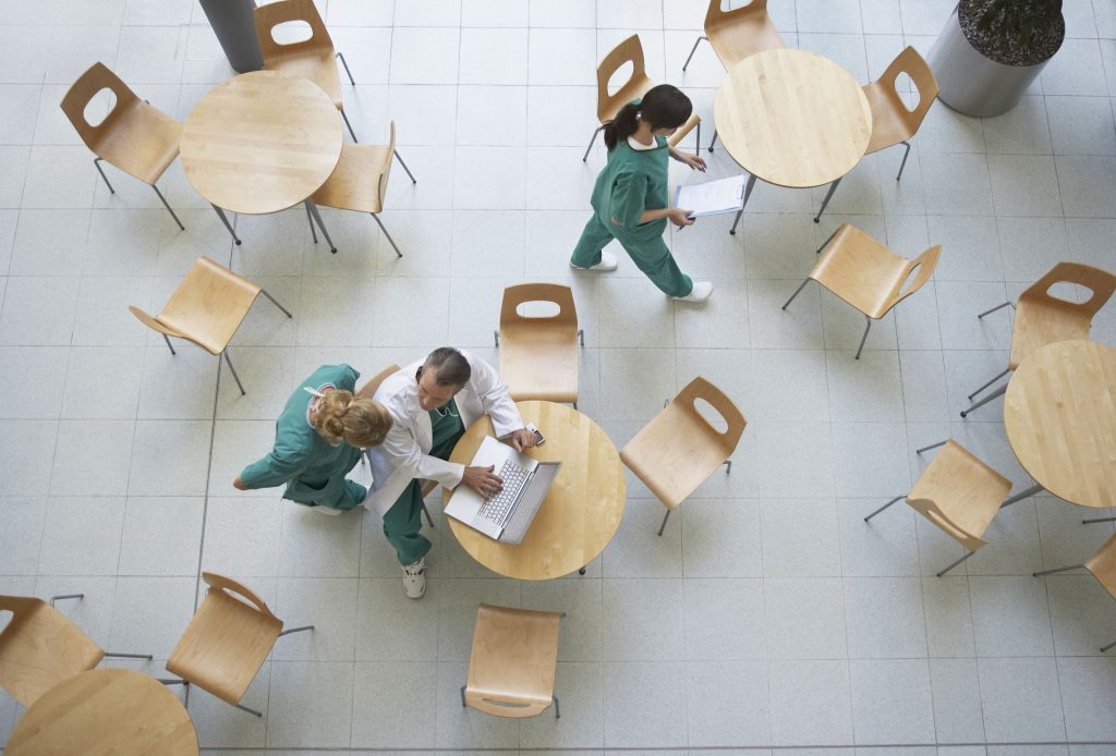 Healthcare workers in hospital eating their meal during a work break.